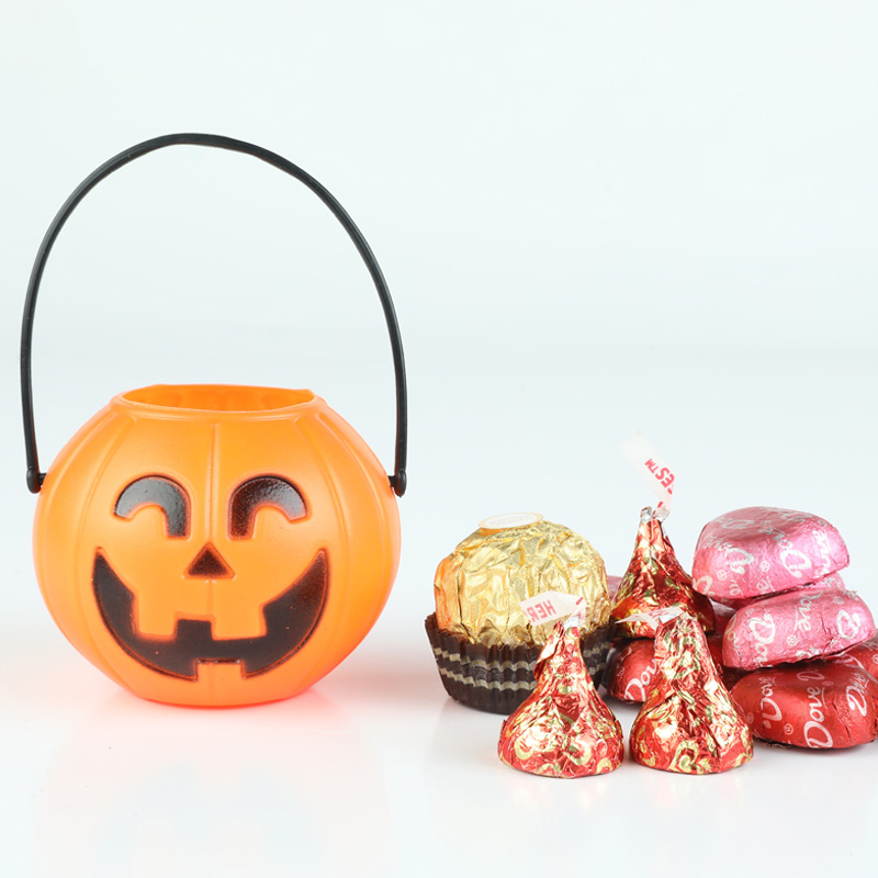 Cubo plástico de la calabaza de la Jack-o-lantern del tarro del caramelo de los niños