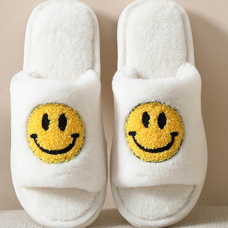 Pantuflas cálidas con lados de cara sonriente